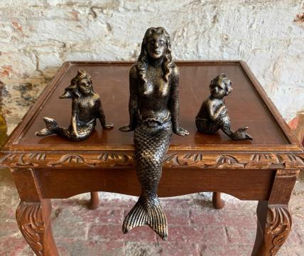 3 small mermaid figures